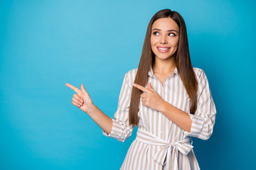 Sticker - Photo of pretty attractive manager lady good mood direct fingers side empty space showing sale price shopping banner wear striped casual dress isolated blue color background