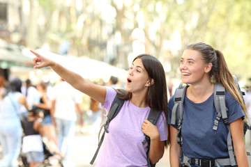 Wall Mural - Backpackers sightseeing in the street finding landmark