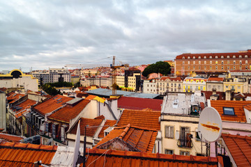 Wall Mural - Aerial view of Lisbon, Portugal at cloudy day with view over city center