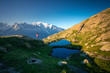© Javier Martinez/ADDICTIVE STOCK - From above small tent and clear lake reflecting sky high in mountains in sunny day in Chamonix, Mont-Blanc