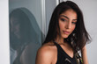 © Kike Arnaiz/ADDICTIVE STOCK - Beautiful passionate brunette Hispanic woman in black wear looking at the camera