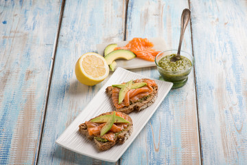 Poster - sliced bread with pesto sauce smocked salmon and avocado