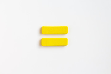 yellow painted wooden equal, craft sign for kid's education isolated, ecological concept