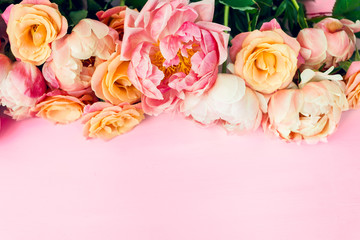 Wall Mural - Fresh bunch of pink peonies and roses on pink background. Card Concept, pastel colors, close up image, copy space