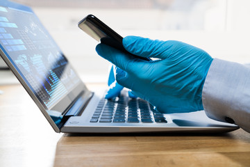 Poster - Gloves Protecting From Coronavirus While Using Laptop And Phone