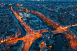© DedMityay - Beautiful night aerial view of Amsterdam downtown from above with many narrow canals, illuminated streets and old historic houses, drone photo.