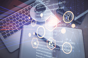 multi exposure of data theme drawing hologram over topview work desk background with computer. conce