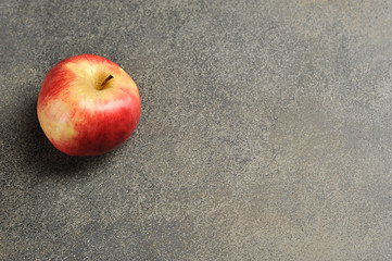 Wall Mural - red Apple on a gray background - top view