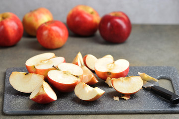 Wall Mural - sliced red apples on a Board with a knife