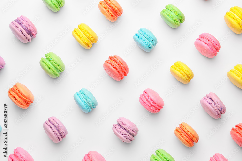 Tasty macarons on white background