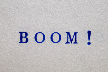 a boom word stamped on a piece of paper.