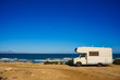 © Voyagerix - Camper car on beach, camping on nature