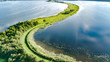 Aerial drone view of path on dam in polder water from above, landscape and nature of North Holland, Netherlands