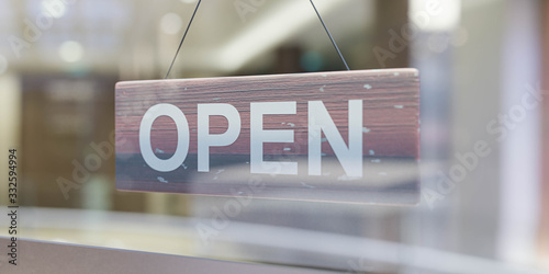Cuadros en Lienzo open sign through a glas shopping mall window blurry background shallow field of