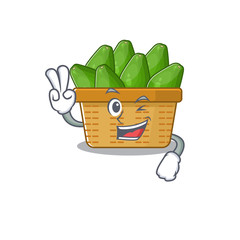 Wall Mural - Cheerful avocado fruit basket mascot design with two fingers