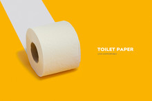 Roll Of Toilet Paper On Top On A Yellow Background For Advertising