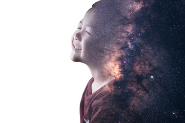 Wall Mural - The double exposure image of the boy thinking overlay with the milky way galaxy image. the concept of imagination, technology, future, and gaming.	
