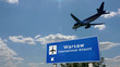 Plane landing in Warsaw Poland with signboard