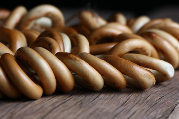 Sticker - bagels for tea on a structural vintage wooden table