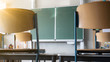 CORONAVIRUS - School closed - Empty classroom with high chairs and empty green blackboard / chalkboard