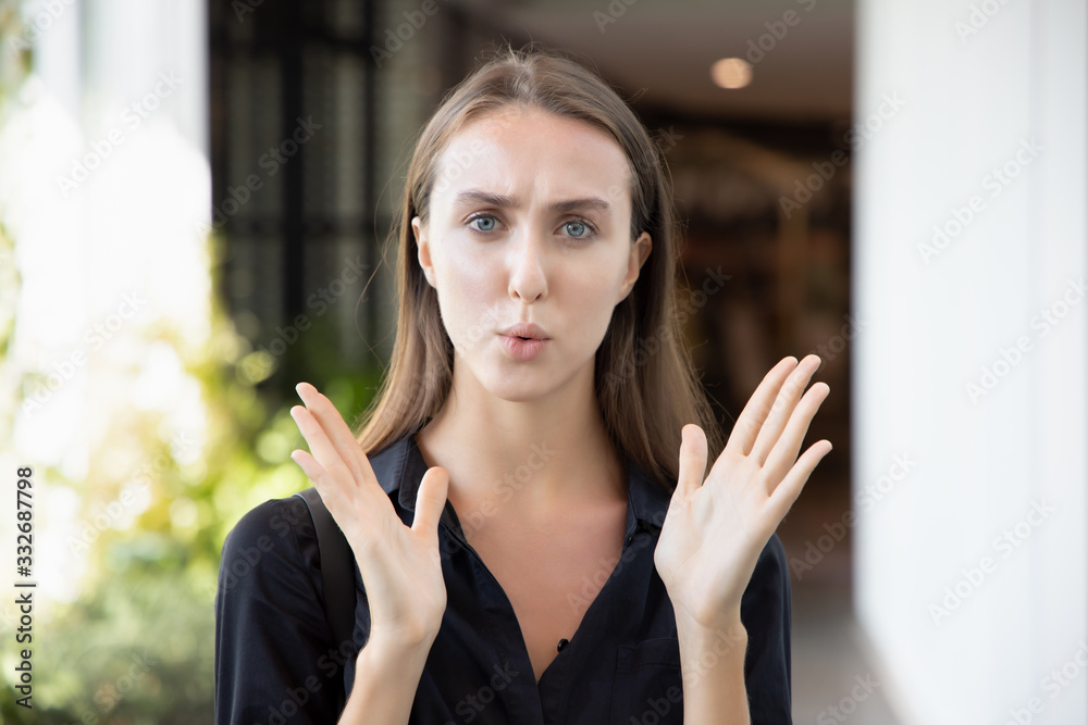 face portrait of excited surprised smiling girl; portrait of happy smiling excited white caucasian girl expression excitement and looking at you with surprise; young adult white caucasian woman model