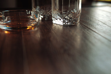 empty glasses for whisky and ash-tray