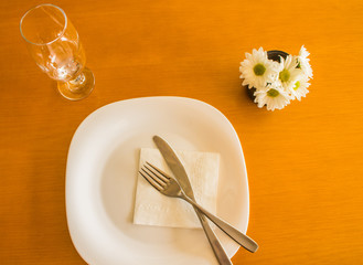 empty plate with spoon fork and knife