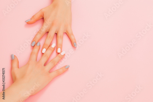 Fényképezés Hands of a beautiful woman on a pink background