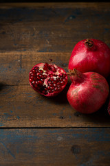 Wall Mural - Several pomegranates on wood boards