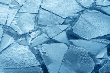 Wall Mural - Top view of cracked blue ice, texture of ice