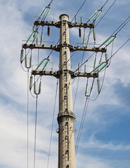 Overhead power line at blue sky background