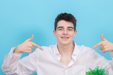 Poster - portrait of young teenager man or student isolated on color background