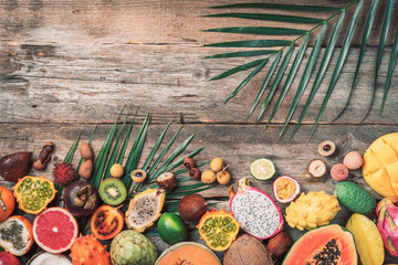 Wall Mural - Exotic fruits - pineapple, papaya, mango, annona, banana, pitahaya, kiwano, african horned melon, tamarillo fruit, granadilla, salak, snake fruit, maracuya, rambutan, lychee, longan, tamarind