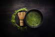 © vetre - Matcha powder. Organic green matcha tea ceremony. Healthy drink. Traditional japanese drink on black wooden background