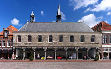 Wall Mural - Gasthuiskerk church facade with its town hall like loggia at a market square in the old town of Zierikzee, Netherlands