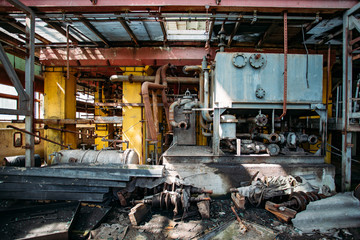 Sticker - Old rusty Industrial tanks connected by pipes connected with valves in abandoned chemical factory