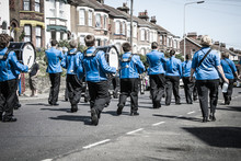 Brass Band Of Young People . View From Back .Carnaval Parade In Dover, UK, England