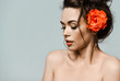 © Dmitry Lobanov - Portrait of young beautiful sexy brunette woman in circle earrings with rose in hand and mouth over light grey background