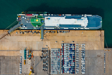 Wall Mural - Aerial view ro-ro ship, Cargo ship transportation of business logistic sea freight, New Cars produced by year up in the port for Cargo ship and Cargo import-export around in the world