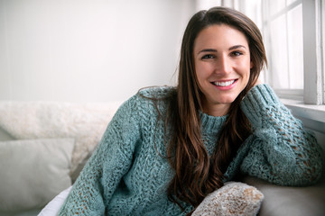 beautiful brunette with perfect white teeth happy after dental visit, smiling in bright room, home h
