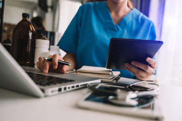 Wall Mural - Medical technology concept. Doctor working with mobile phone and stethoscope and digital tablet laptop 