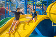 Father and son on a water slide in the water park