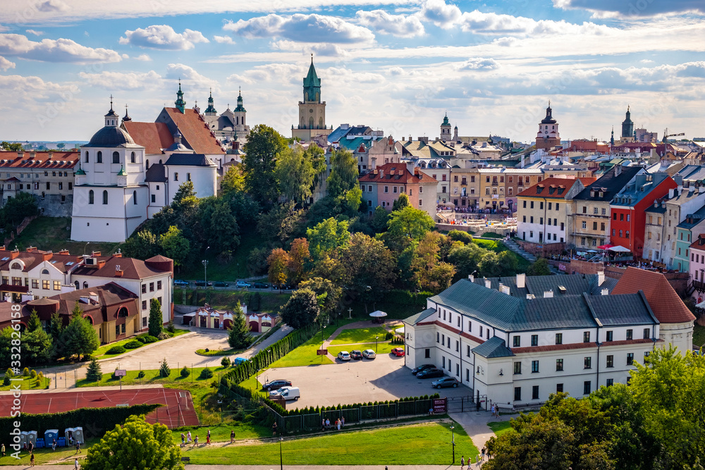 Lublin, Poland - Panoramic view of city center with St. Stanislav Basilica and Trinitarian Tower in historic old town quarter - obrazy, fototapety, plakaty 