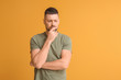 © Pixel-Shot - Thoughtful man on color background. Concept of choice