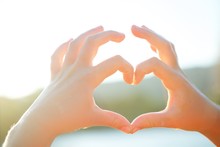 The Hand Of A Girl Or Girl Represents The Heart Symbol.