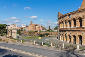 Wall Mural -  Following the coronavirus outbreak, the italian Government has decided for a massive curfew, leaving even the Old Town, usually crowded, completely deserted. Here in particular the Colosseum