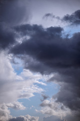 Wall Mural - storm clouds against a blue sky