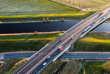 A Viaduct Bridge Crossover A Canal Of Highway A59 During Sunrise Near Waalwijk, Noord Brabant, Netherlands