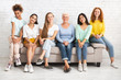 © Prostock-studio - Mutiracial Ladies Of Different Age Sitting On Couch Posing Indoor