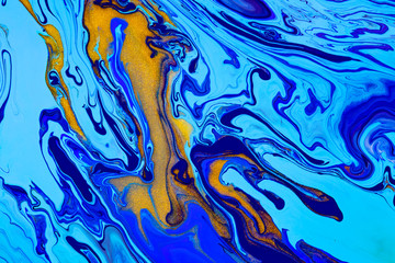 Wall Mural - Fluid art texture. Backdrop with abstract iridescent paint effect. Liquid acrylic artwork with chaotic mixed paints. Can be used for posters or wallpapers. Blue, golden and cyan overflowing colors